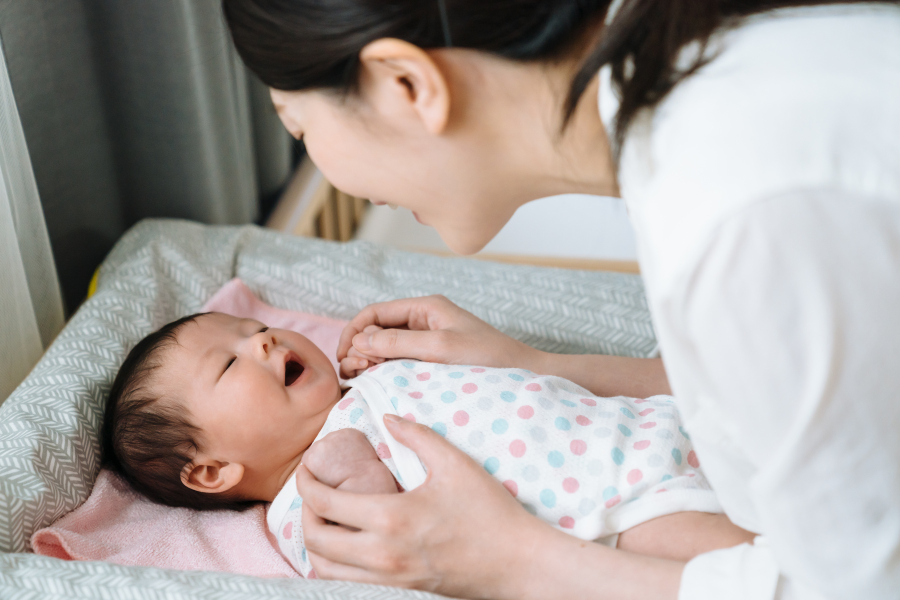 Mom Playing with Newborn Baby